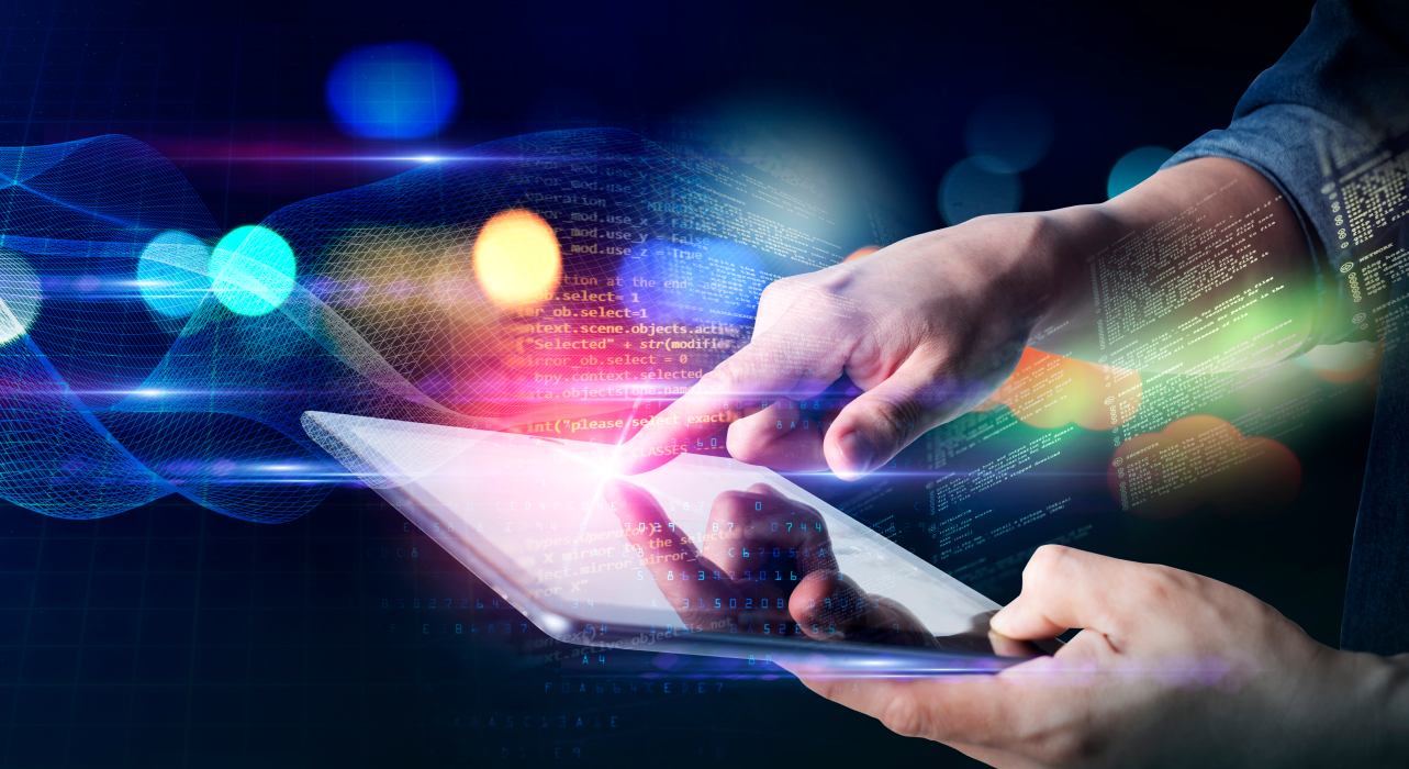 Hands interacting with a tablet, emitting colorful digital light trails and bokeh effects on a dark background, conveying a sense of technology and innovation.