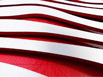 Red and white modern building represents Commvault